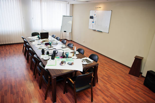istock Modern business office interior containing tables and chairs, laptop, camera and office supplies with no employees. 1137533241