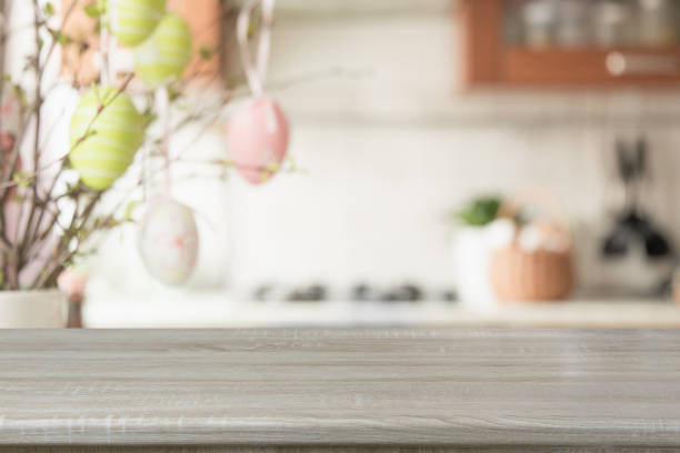 Easter. Blurred kitchen and wooden tabletop with space for display your product.