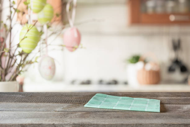 istock Easter. Blurred kitchen and wooden tabletop with space for display your product. 1137534773