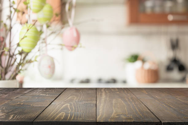 istock Easter. Blurred kitchen and wooden tabletop with space for display your product. 1137534774