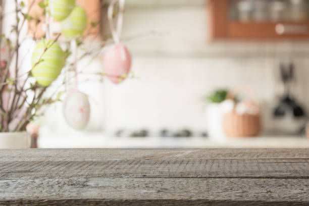istock Easter. Blurred kitchen and wooden tabletop with space for display your product. 1137534775