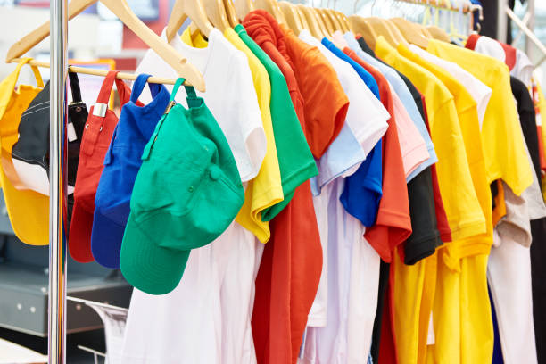 istock Colored t-shirts and caps in store 1137539104