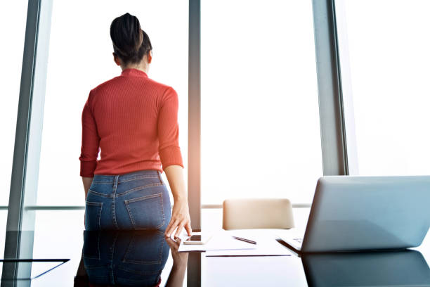 istock Woman standing in front of window 1137539509