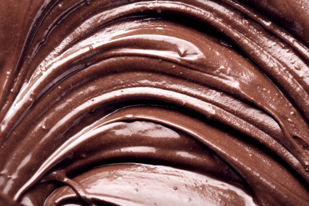istock Melted chocolate swirl as a background closeup 1137540558
