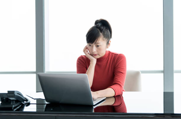 istock Woman using laptop in the office 1137540800