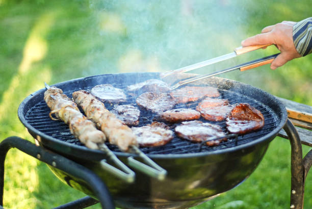 istock men's hands are cooking meat on grill 1137542230