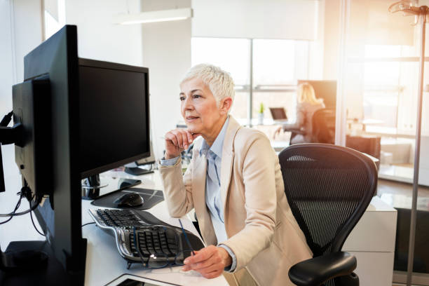 istock Mature business women working at the office 1137543393