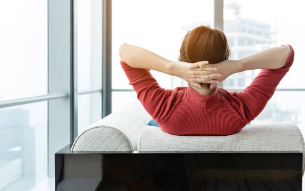 istock Tired woman resting on sofa 1137545238