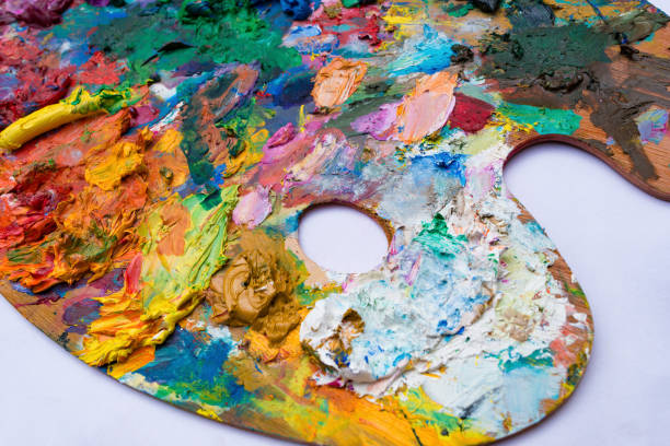 istock bright oil paint palette close up on white background 1137546820
