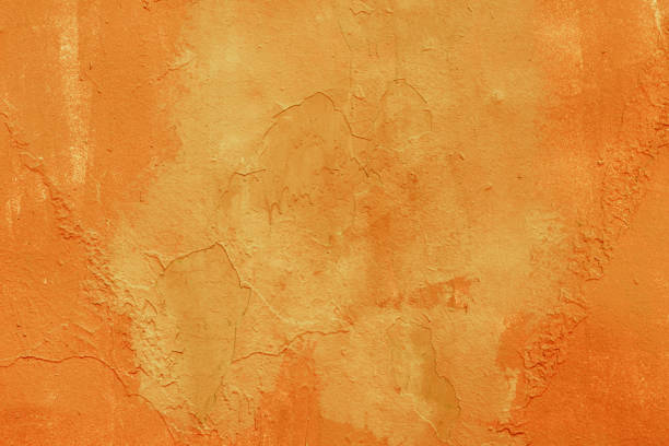 istock Metal surface carelessly painted in orange color, background 1137547225