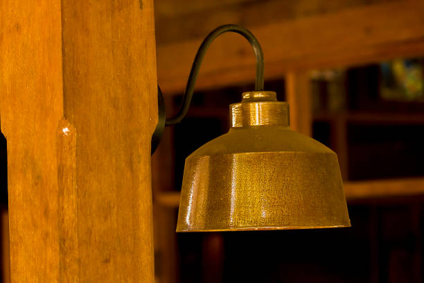gooseneck light mounted on barn exterior with shadow