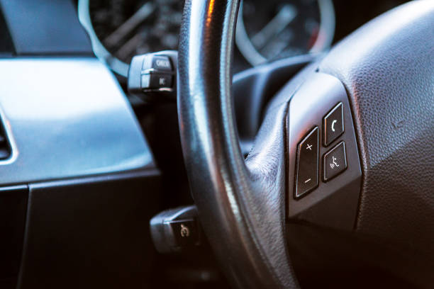 istock car steering wheel and car controls. cruise control, handsfree and other extras. 1137548725