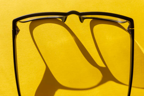 istock Conceptual background black glasses on yellow 1137550047