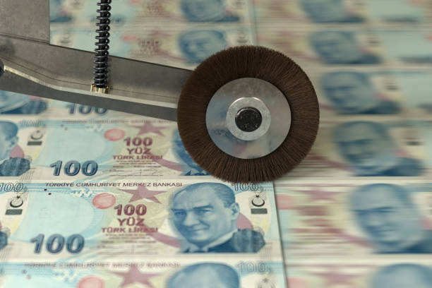 Turkish 100 Lira banknotes being printed Turkish 100 Lira banknotes being printed central bank stock pictures, royalty-free photos & images