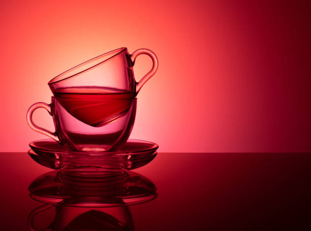 istock A set of two glass cups for tea on a red pink background 1137551006