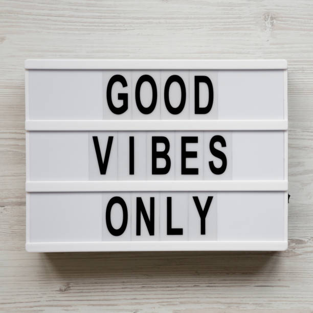 istock 'Good vibes only' words on lightbox over white wooden surface, top view. From above, overhead, flat lay. Copy space. 1137551021