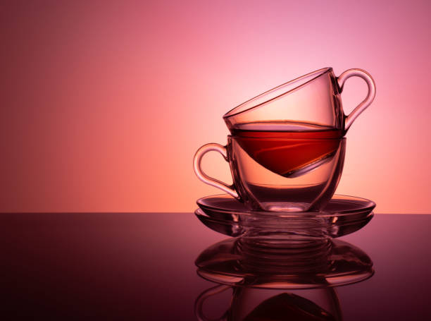istock A set of two glass cups for tea on a red pink background 1137551025