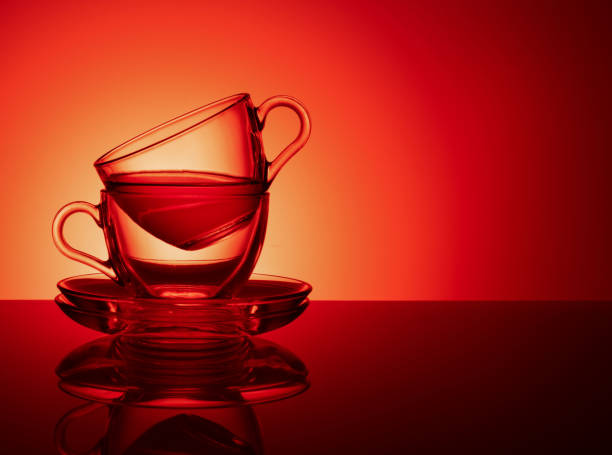istock A set of two glass cups for tea on a red pink background 1137551034