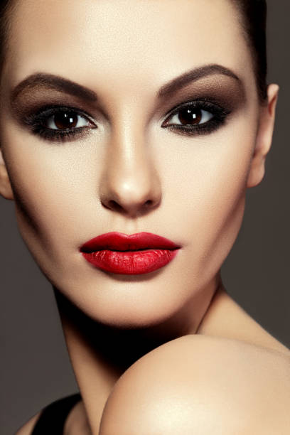 istock Beautiful young model with red lips. Bright makeup. 1137553588