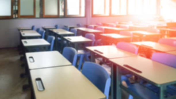 istock School classroom in blur background without young student; Blurry view of elementary class room no kid or teacher with chairs and tables in campus. 1137555056