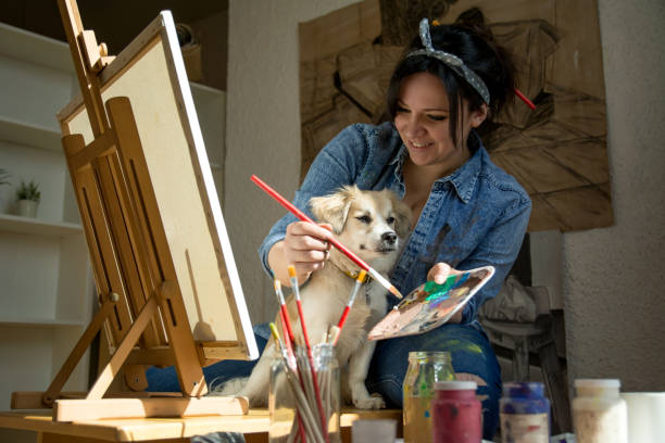istock Artist painting with dog 1137557733