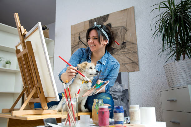 istock Female artist painting 1137557893