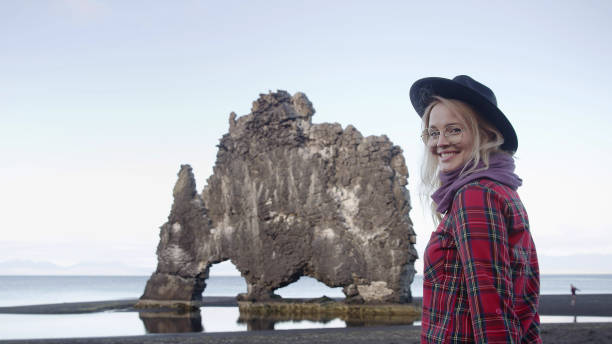 istock Woman enjoying black beach. Admiring the view 1137558038