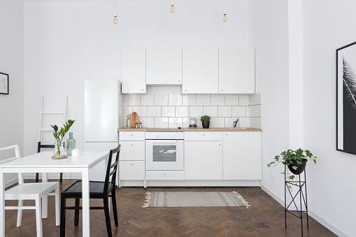 White kitchen interior with table