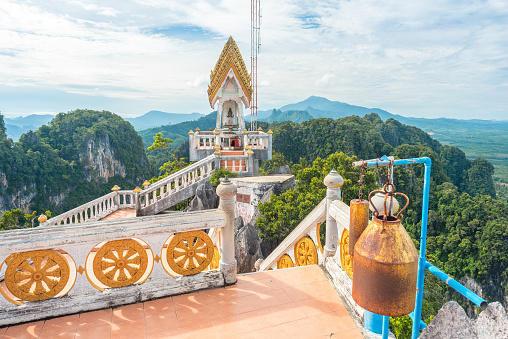 Temple of the Tiger Cave's mountain in Krabi, Thailand with the scenic view of limestone rocks covered with tropical forest.