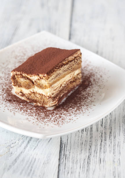 istock Portion of tiramisu on the white plate 1137559687