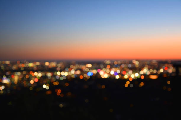 Bokeh lights of a city at sunset. Bokeh lights of a city at sunset. Los Angeles by night. griffith park photos stock pictures, royalty-free photos & images
