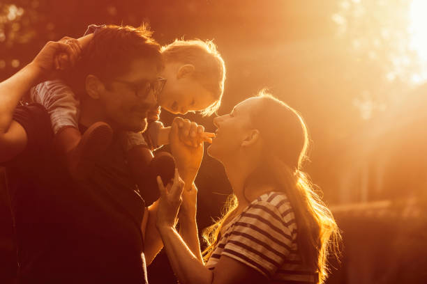 Happy family in sunset