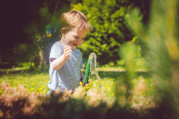 istock Cute child gardening at springtime 1137562842