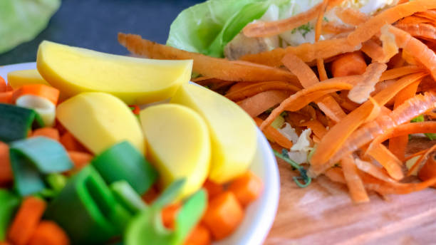 istock Carrots, leeks and potatoes on the plate and peeled 1137562954