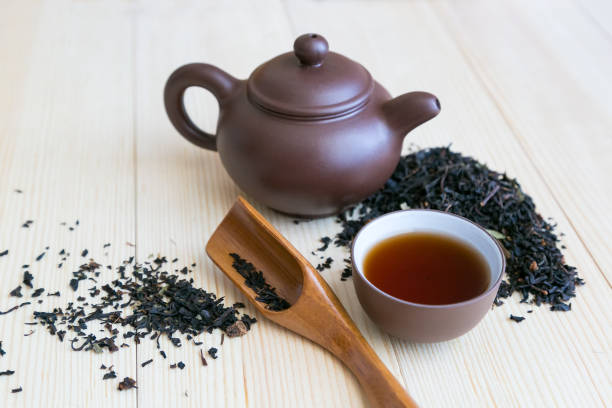 istock Dishes for tea and black tea sprinkled on the table 1137564595