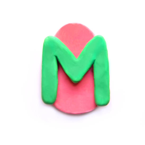 plasticine letter m in the shape of an easter egg - letter m alphabet color image flower imagens e fotografias de stock