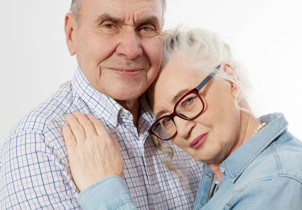 closeup faces. happy senior family couple isolated on white background. close up portrait woman and man with wrinkled face. elderly grandparents people have fun. smiling mature male and female. - senior adult human face male action imagens e fotografias de stock