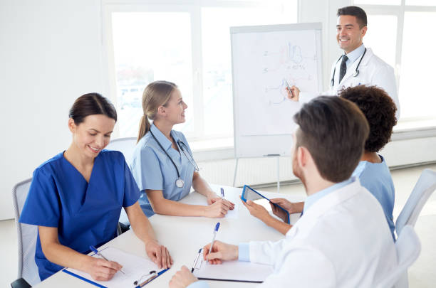 istock group of doctors on presentation at hospital 1137568279