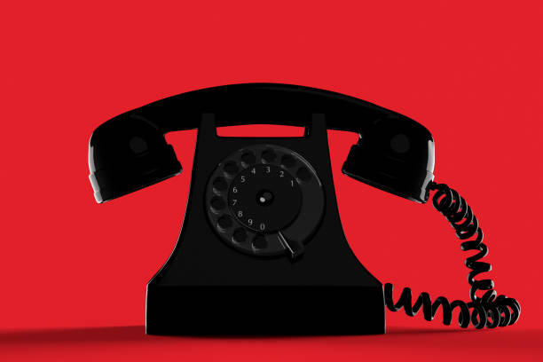 istock black vintage telephone against a red background 1137568499