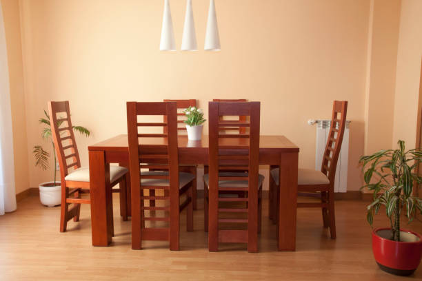 istock Dining room with chairs, table and plants with parquet 1137569382