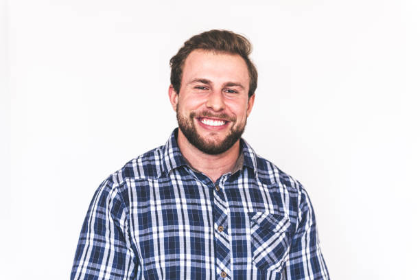 happy young strong bearded man studio shot of happy young strong smiling bearded man man beard plaid shirt stock pictures, royalty-free photos & images