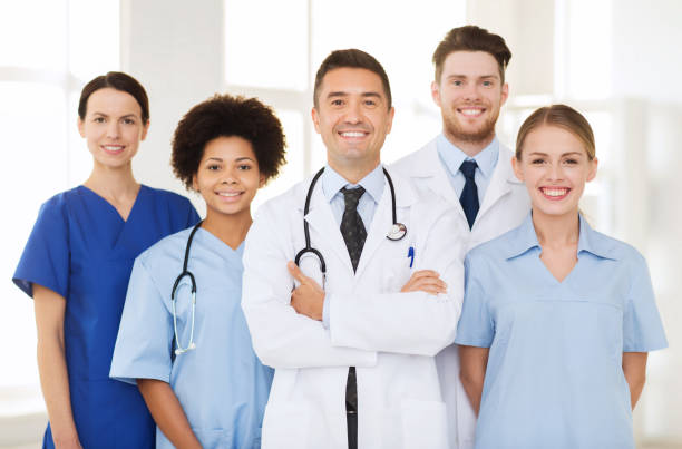 istock group of happy doctors at hospital 1137569897