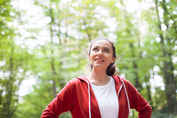 istock Young woman exercising in the park 1137571484