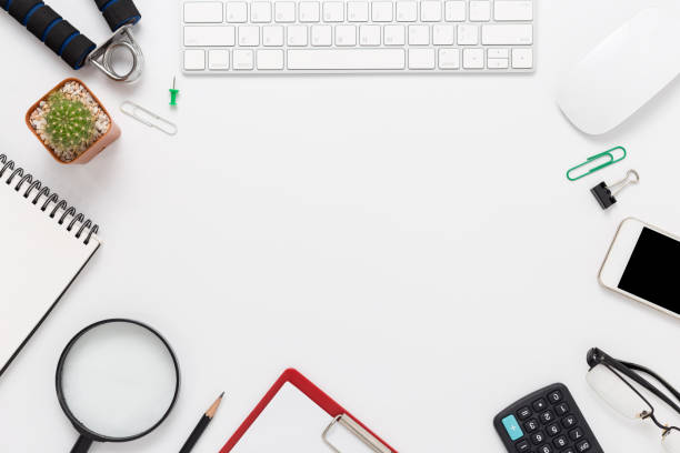 istock white office desk with copy space with smartphone, computer and office supplies top view 1137571627