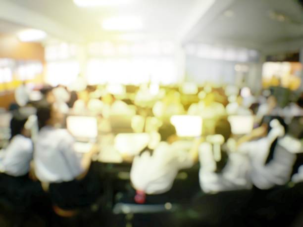 istock Blurred image of group of students are learning and lecture and using computer together in classroom for study and workshop in computers room at school. education technology or training concept. 1137573313
