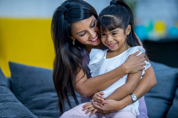 istock Mother and daughter hug 1137575940