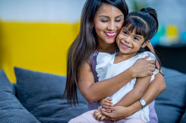 istock Mother and daughter hug 1137575941