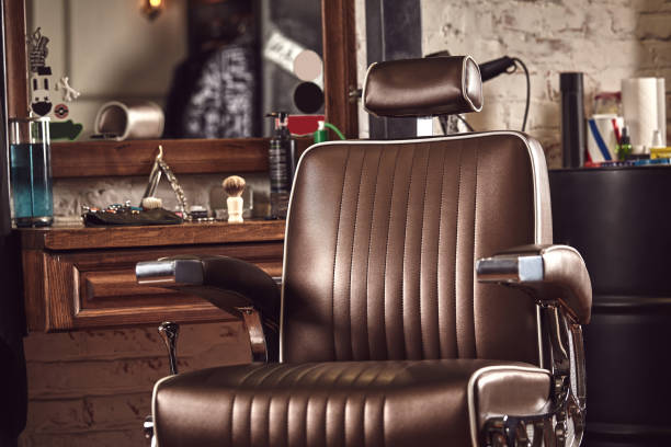 Barbershop armchair. Modern hairdresser and hair salon, barber shop for men. Barbershop brown armchair. Modern hairdresser and hair salon, barber shop for men. barber shop stock pictures, royalty-free photos & images