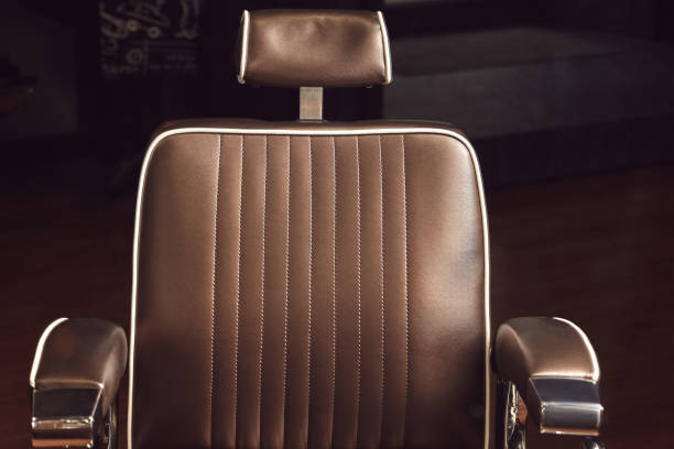 istock Brown leather chair in barbershop. Loft style 1137576252