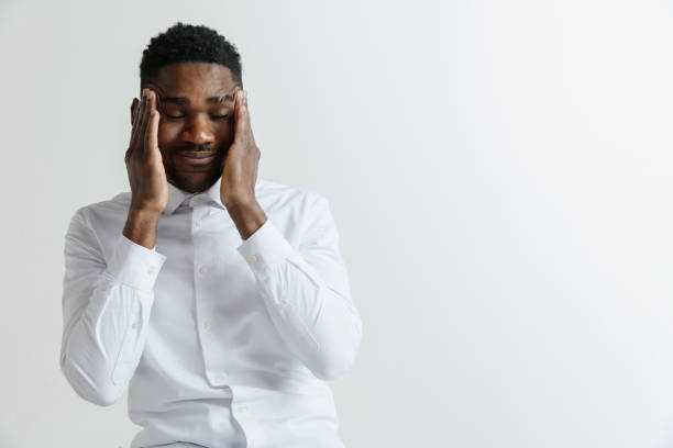 istock Stressed young african american man having terrible strong headache. 1137577967